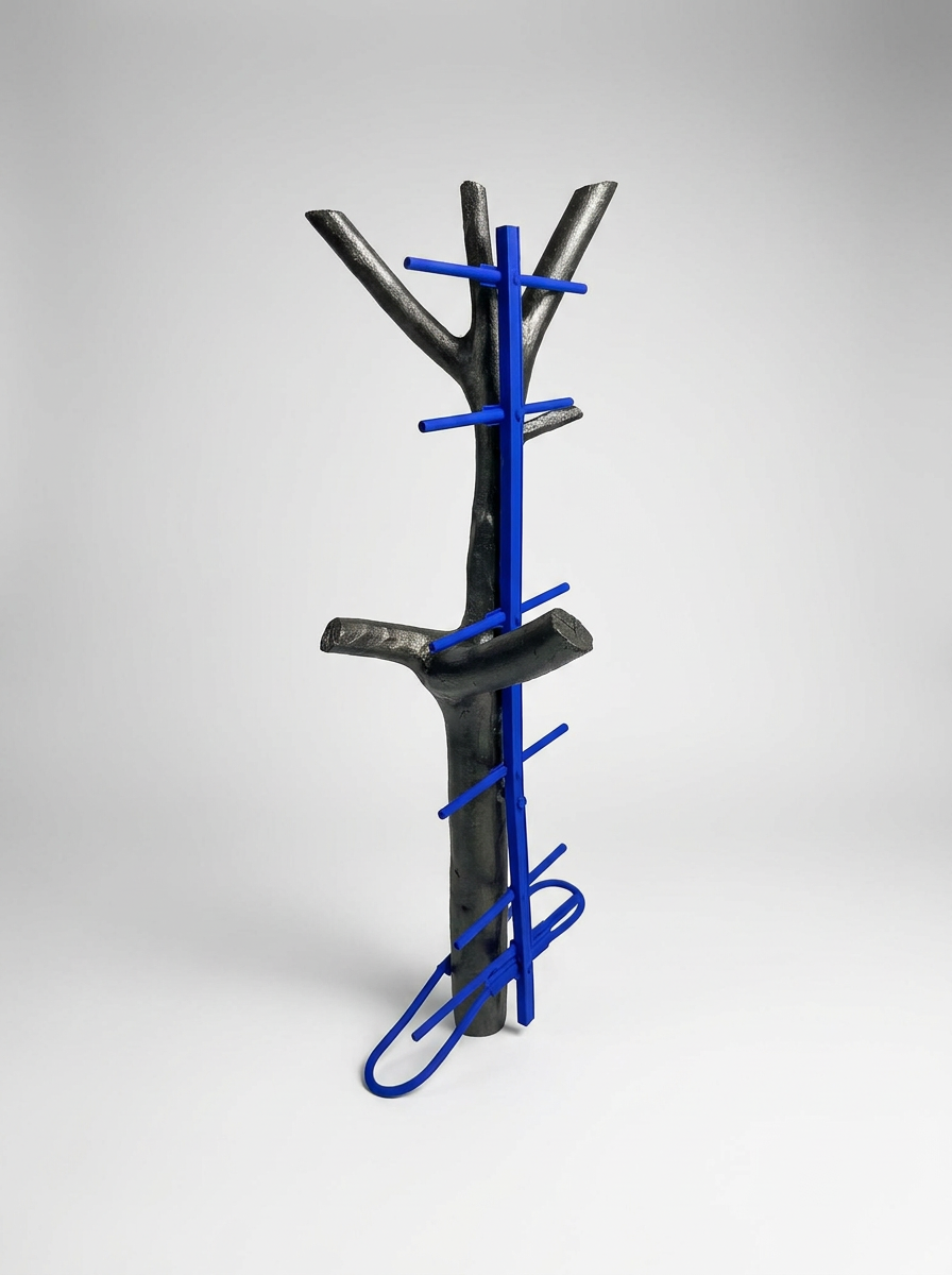 Black and blue abstract sculpture on a gray background