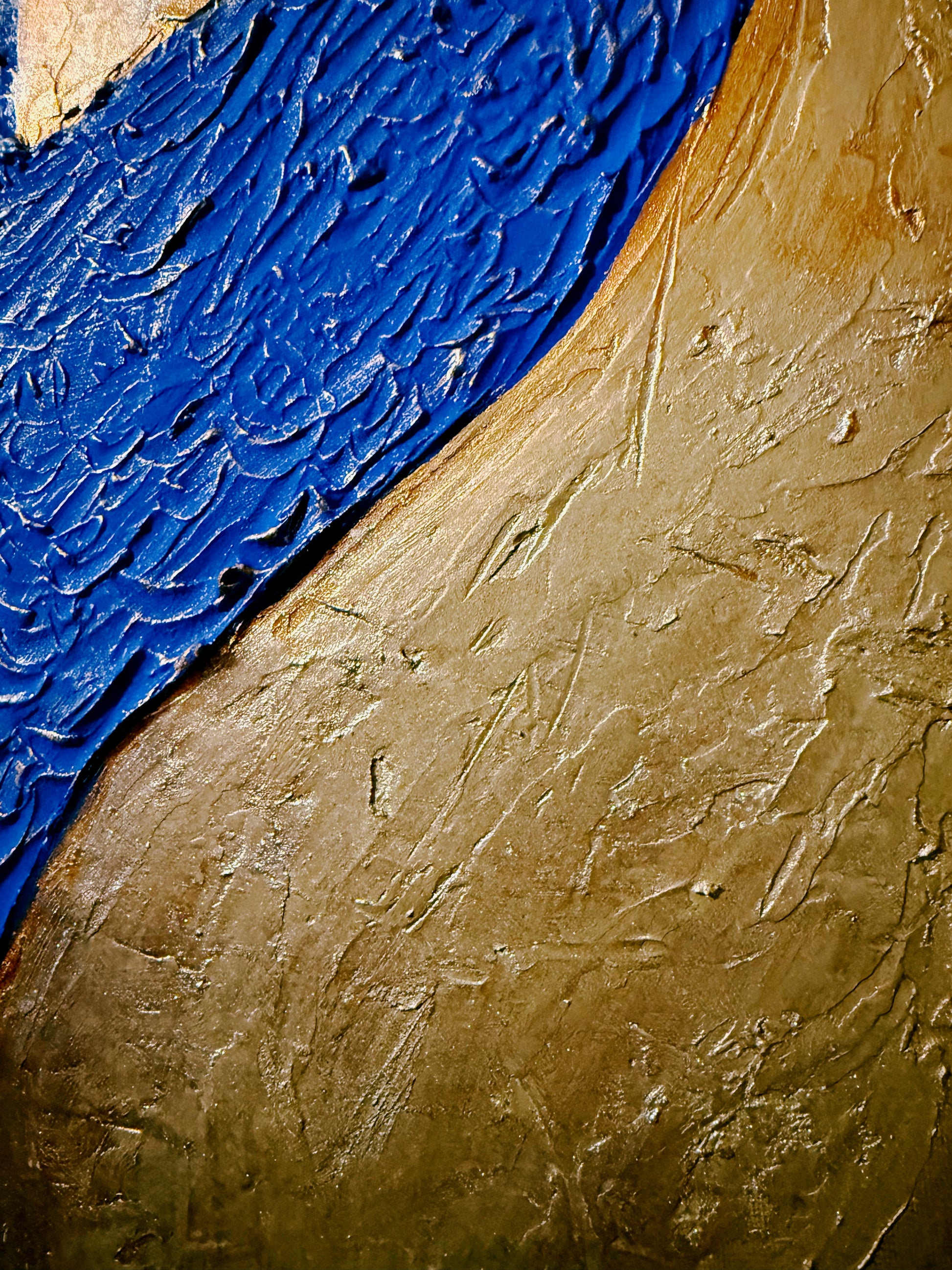 Close-up of textured blue and gold surface