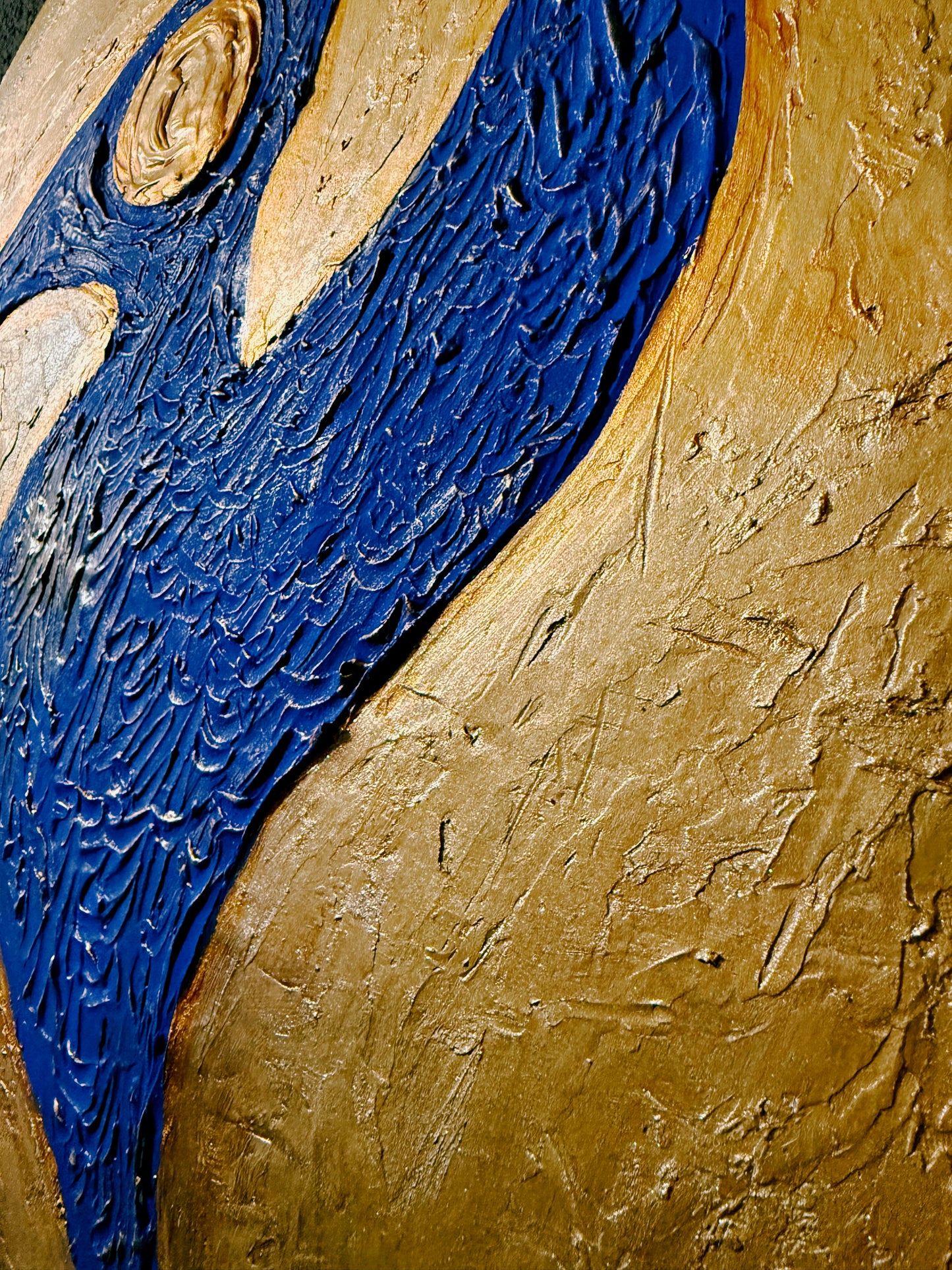 Abstract art piece with blue and gold colors