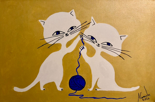 Two white cats playing with a blue yarn ball on a gold background