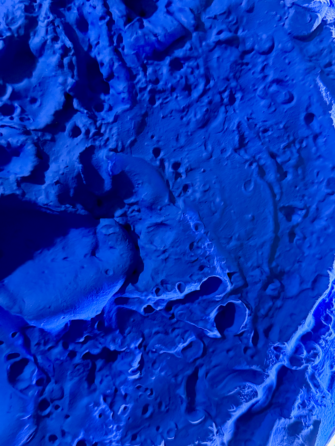 Close-up of blue textured material with a rough surface