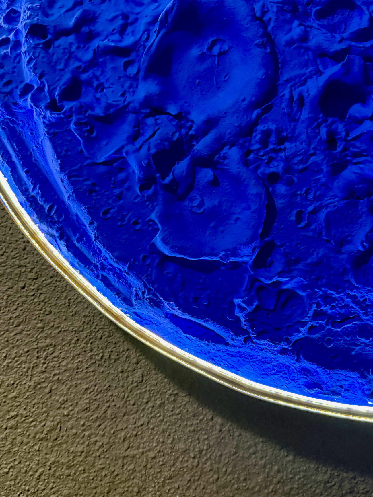 Close-up of a blue textured material on a gray background